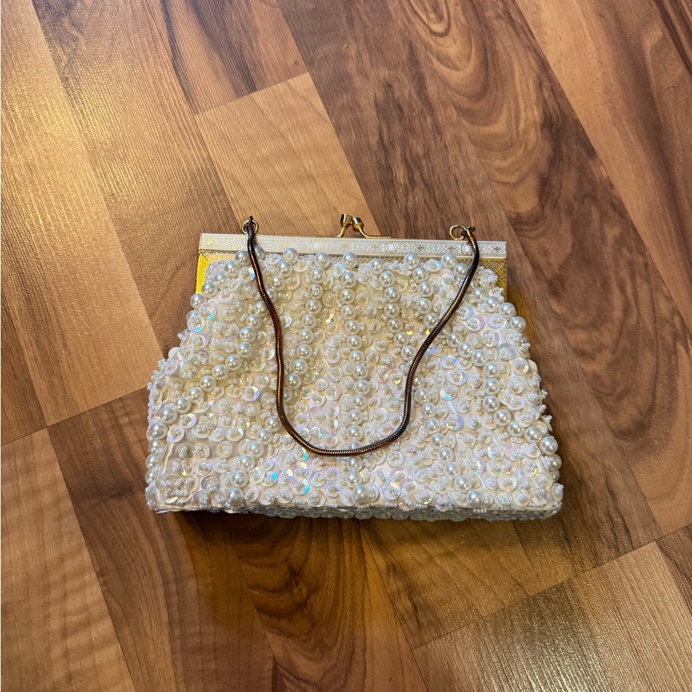 Elegant sequence and Pearl-Embellished Cream mini hand Bag with gold accents